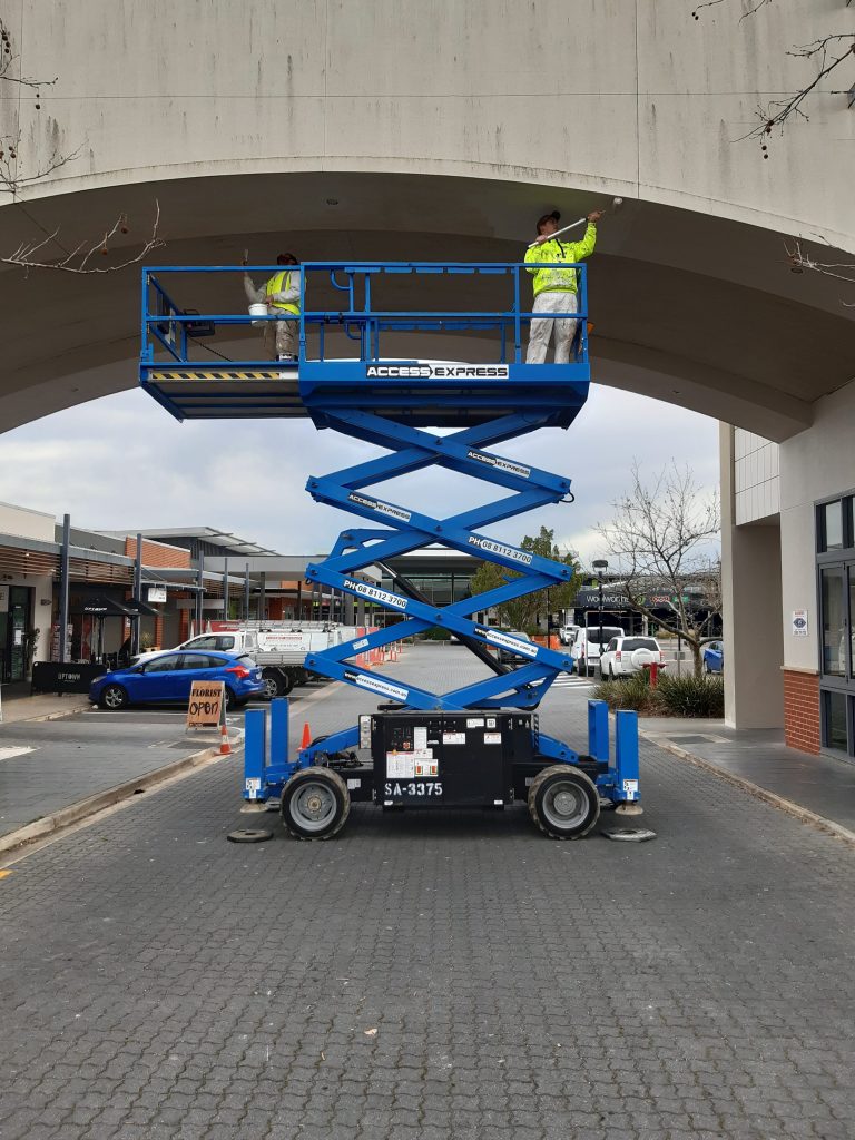 Access Express Genie Scissor Lift Used for Maintenance Work Under Bridge