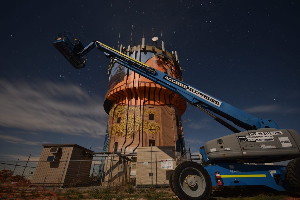 Access Express Genie Boom Lift 85ft Port Vincent Twilight Mural Building