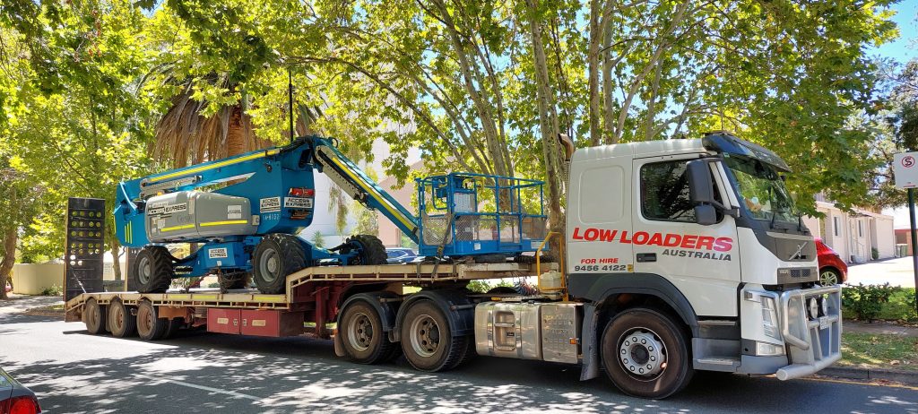 Low Loaders Truck with Access Express Genie Boom Lift on Site at Mill Point Road Z135